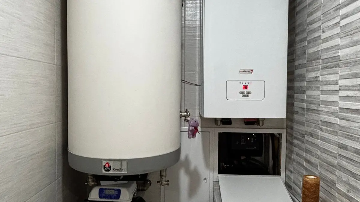 Hot water cylinder next to a wall-hung boiler