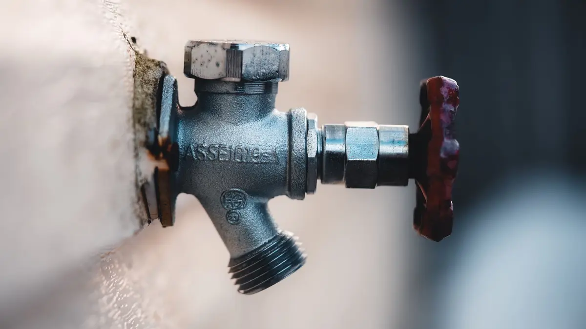 Brass outside tap mounted on a wall