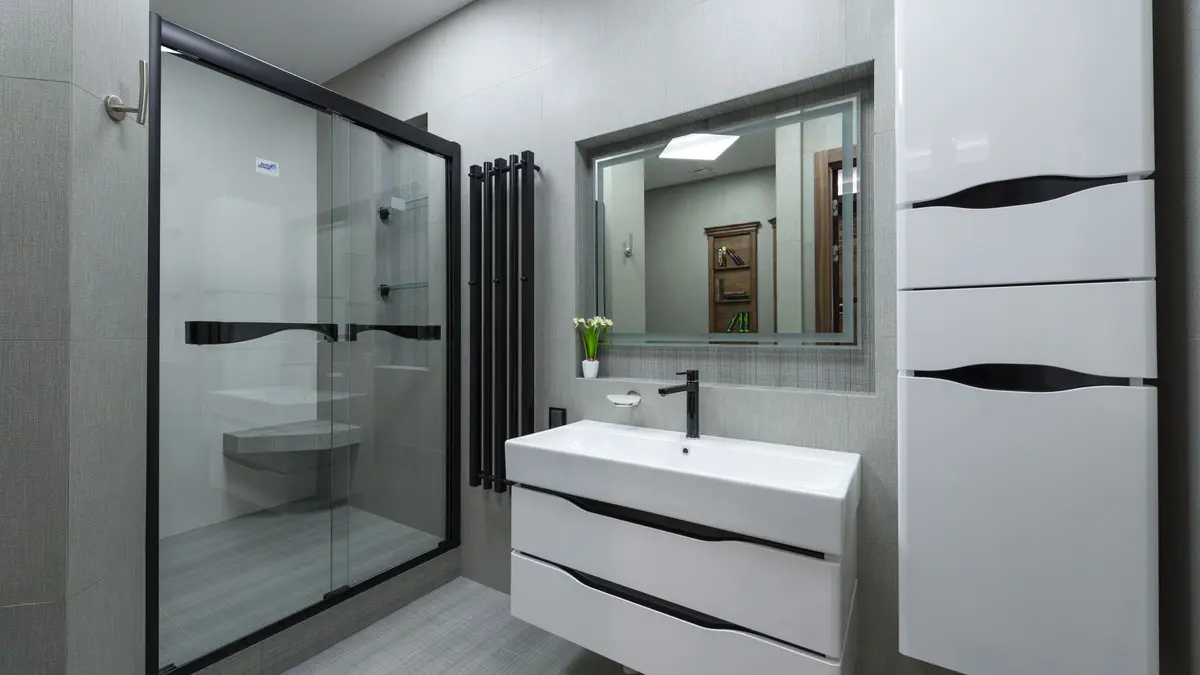 Modern bathroom with a shower cabin and vanity unit