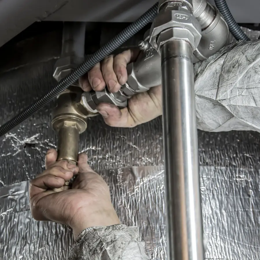 Fitting pipework under a kitchen sink