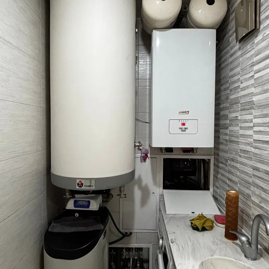 Hot water cylinder beside a wall-hung boiler
